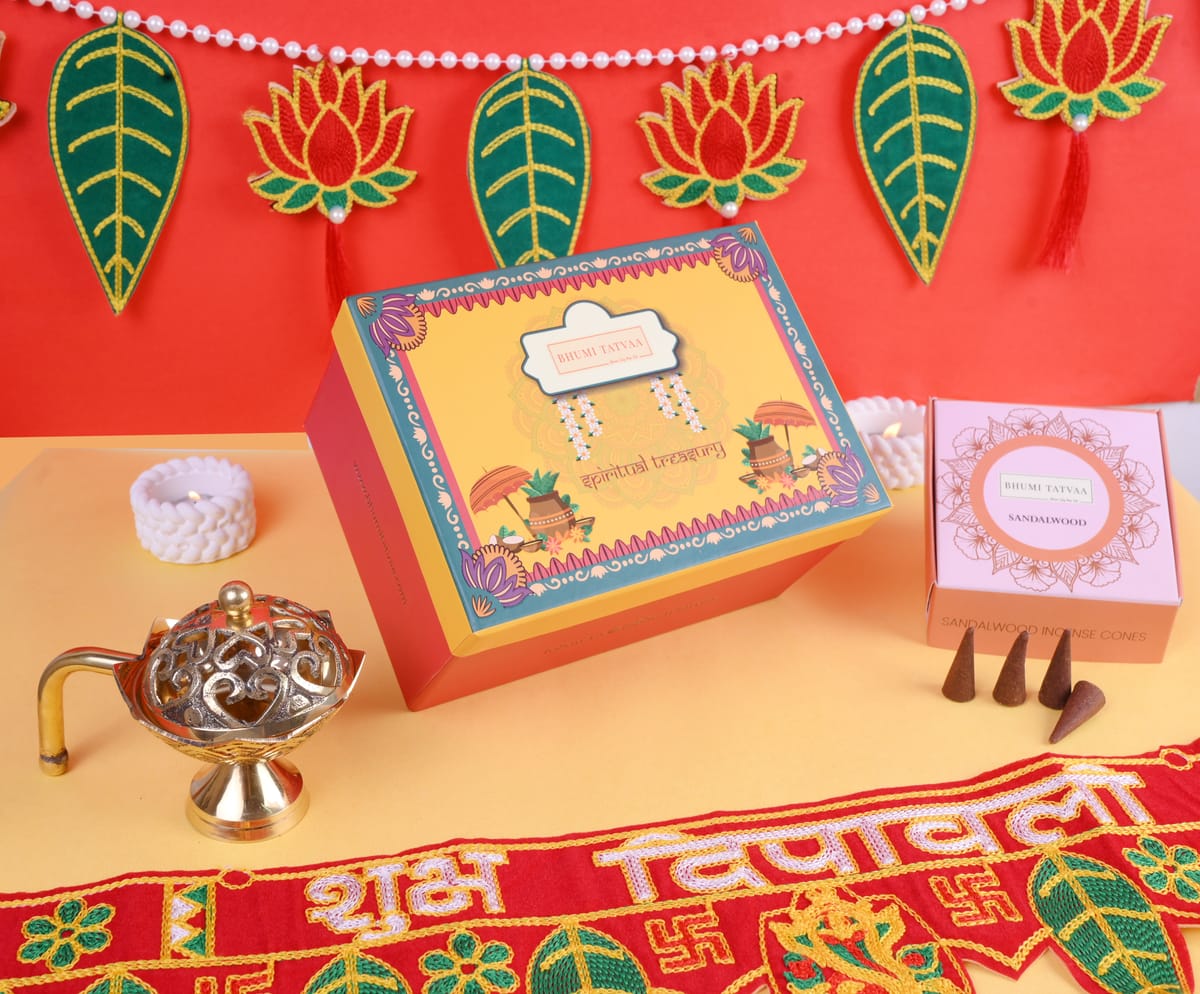 Spiritual Treasure box styled closed with a brass diya and festive props